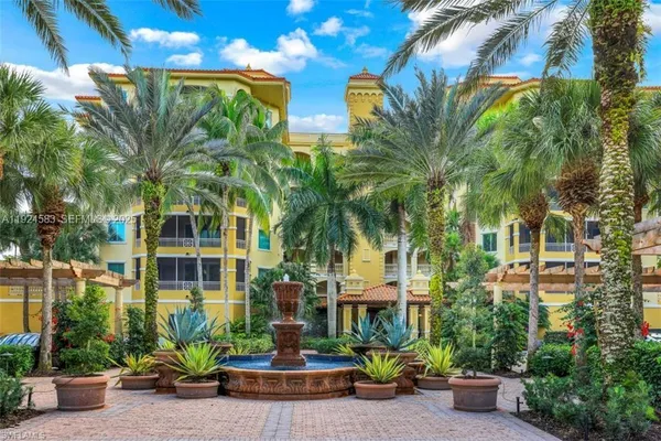 front view of a building with potted plants