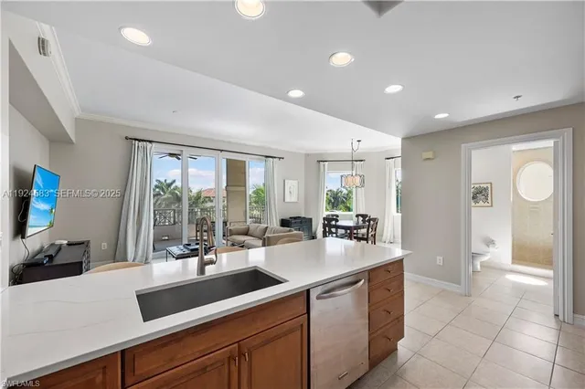 a kitchen with a sink and natural light