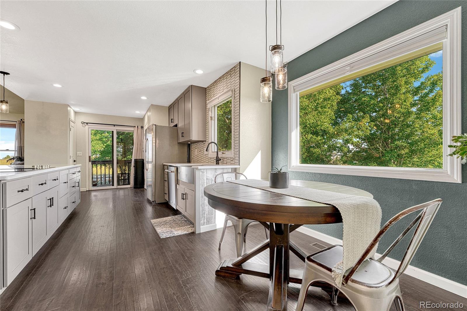 2460 Eileen Way Parker, CO 80138 - Photo 11 of 47 a living room with furniture and a large window