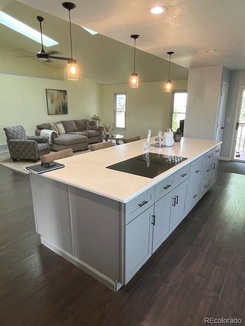 2460 Eileen Way Parker, CO 80138 - Photo 12 of 47 a large white kitchen with a large island