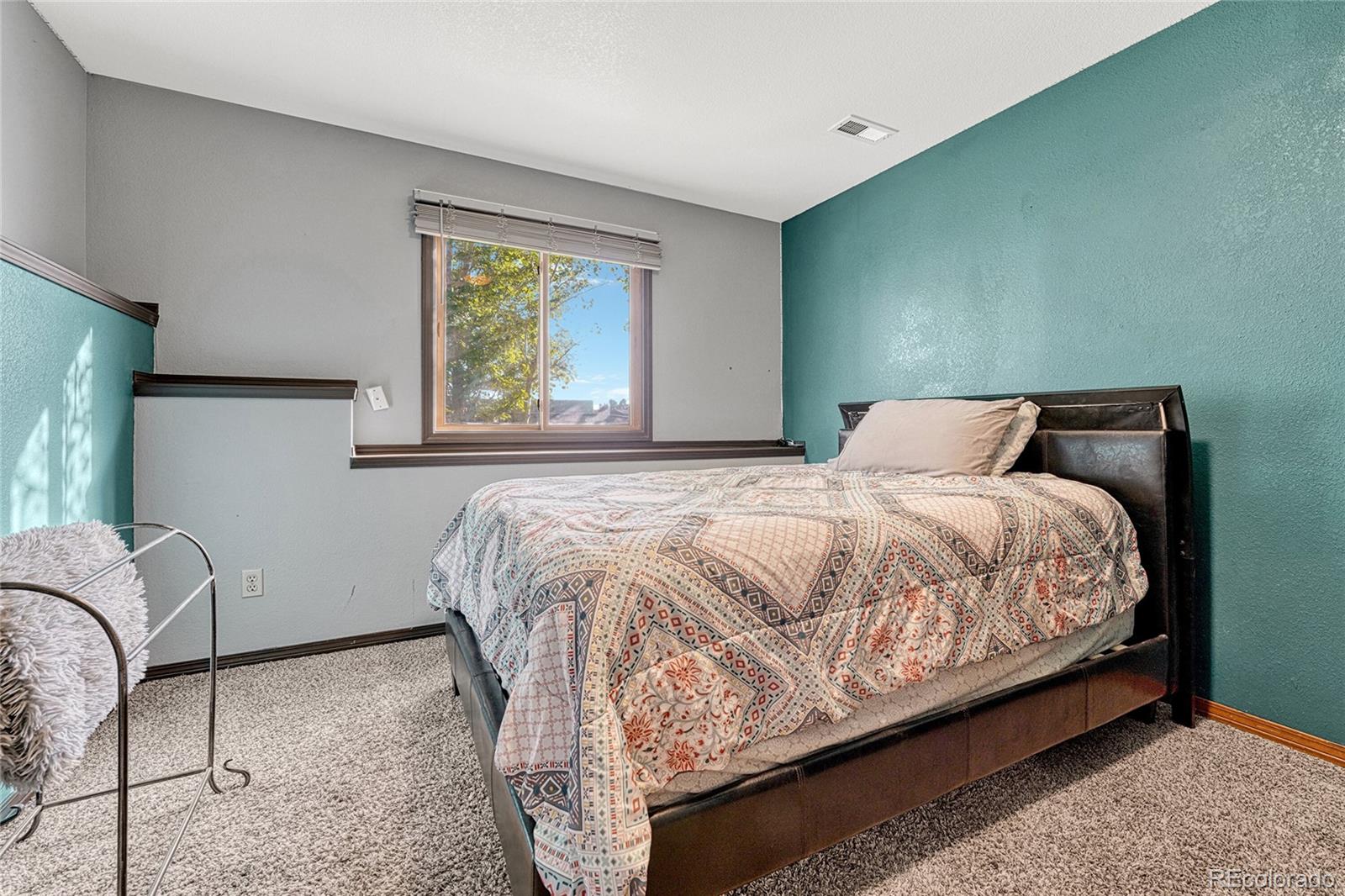 2460 Eileen Way Parker, CO 80138 - Photo 21 of 47 a bedroom with a bed and window