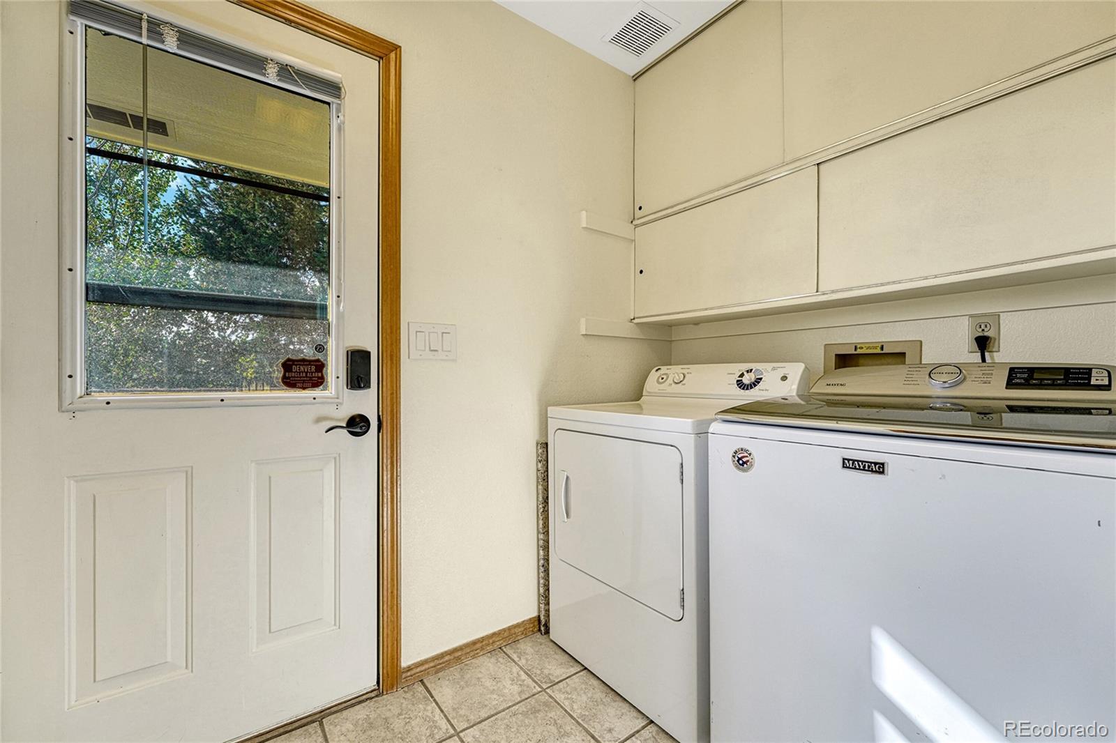 2460 Eileen Way Parker, CO 80138 - Photo 24 of 47 a utility room with dryer and washer