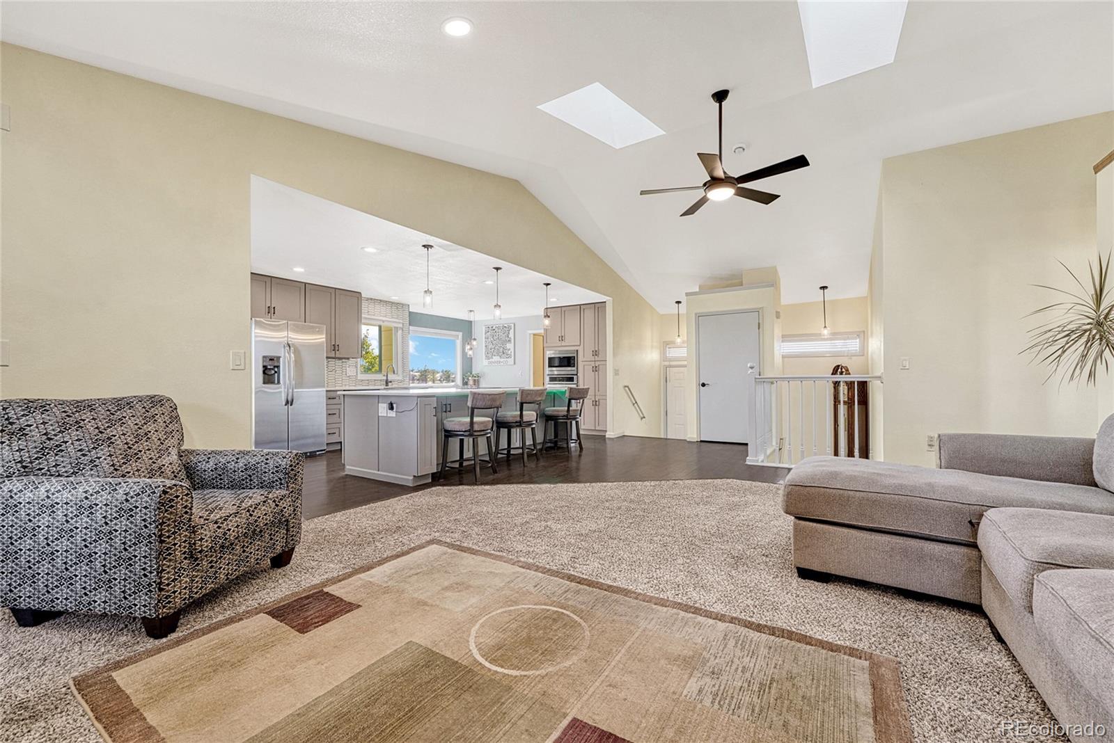 2460 Eileen Way Parker, CO 80138 - Photo 4 of 47 a living room with furniture and kitchen view