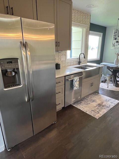 2460 Eileen Way Parker, CO 80138 - Photo 10 of 47 a kitchen with stainless steel appliances granite countertop a sink stove and refrigerator