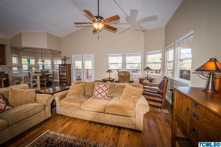 45220 Hammond Drive Three Rivers, CA 93271 - Photo 19 of 31 a living room with furniture a chandelier fan and a large window