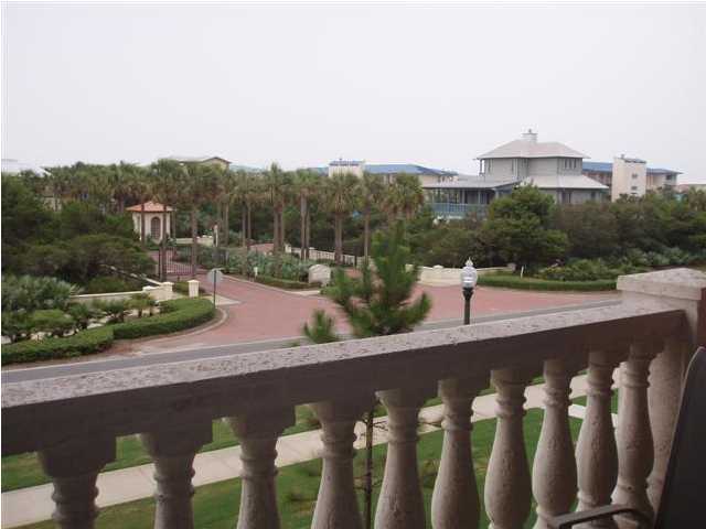 10343 East County Hwy Inlet Beach, Unit 220F 30A Inlet Beach, FL 32413 - Photo 15 of 15 a view of a street with a bench and a view of a lake