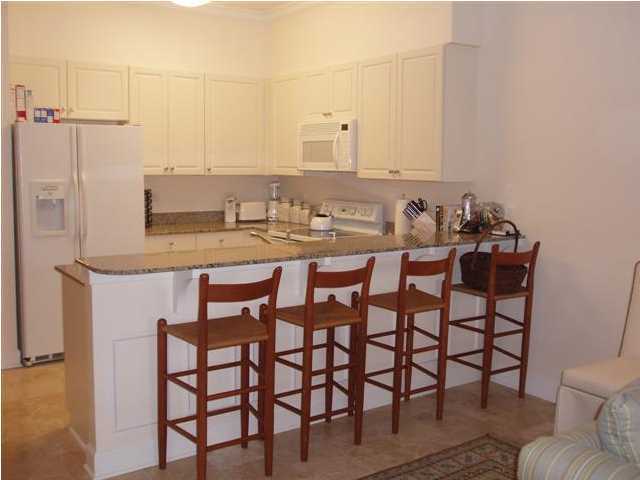 10343 East County Hwy Inlet Beach, Unit 220F 30A Inlet Beach, FL 32413 - Photo 3 of 15 a view of a dining room and chairs