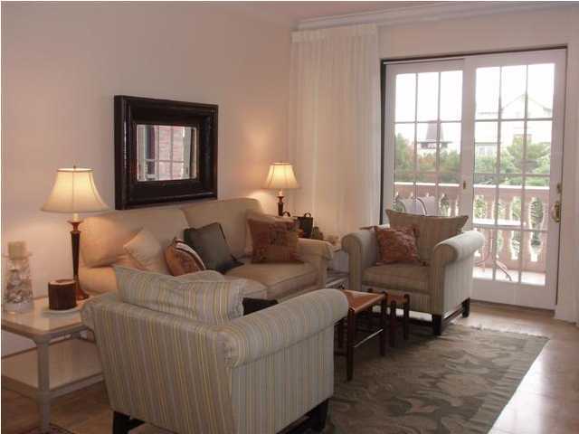 10343 East County Hwy Inlet Beach, Unit 220F 30A Inlet Beach, FL 32413 - Photo 4 of 15 a living room with furniture and a lamp