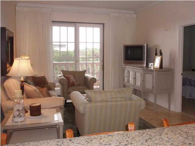 10343 East County Hwy Inlet Beach, Unit 220F 30A Inlet Beach, FL 32413 - Photo 5 of 15 a living room with furniture and a flat screen tv