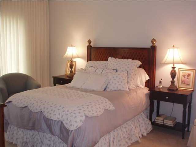 10343 East County Hwy Inlet Beach, Unit 220F 30A Inlet Beach, FL 32413 - Photo 9 of 15 a bedroom with a bed and a lamp