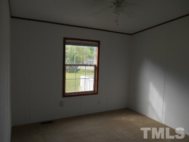 11366 Old Us 64 Spring Spring Hope, NC 27882 - Photo 11 of 12 an empty room with a window