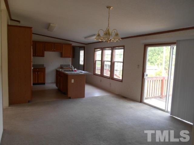 11366 Old Us 64 Spring Spring Hope, NC 27882 - Photo 10 of 12 a living room with furniture and a chandelier