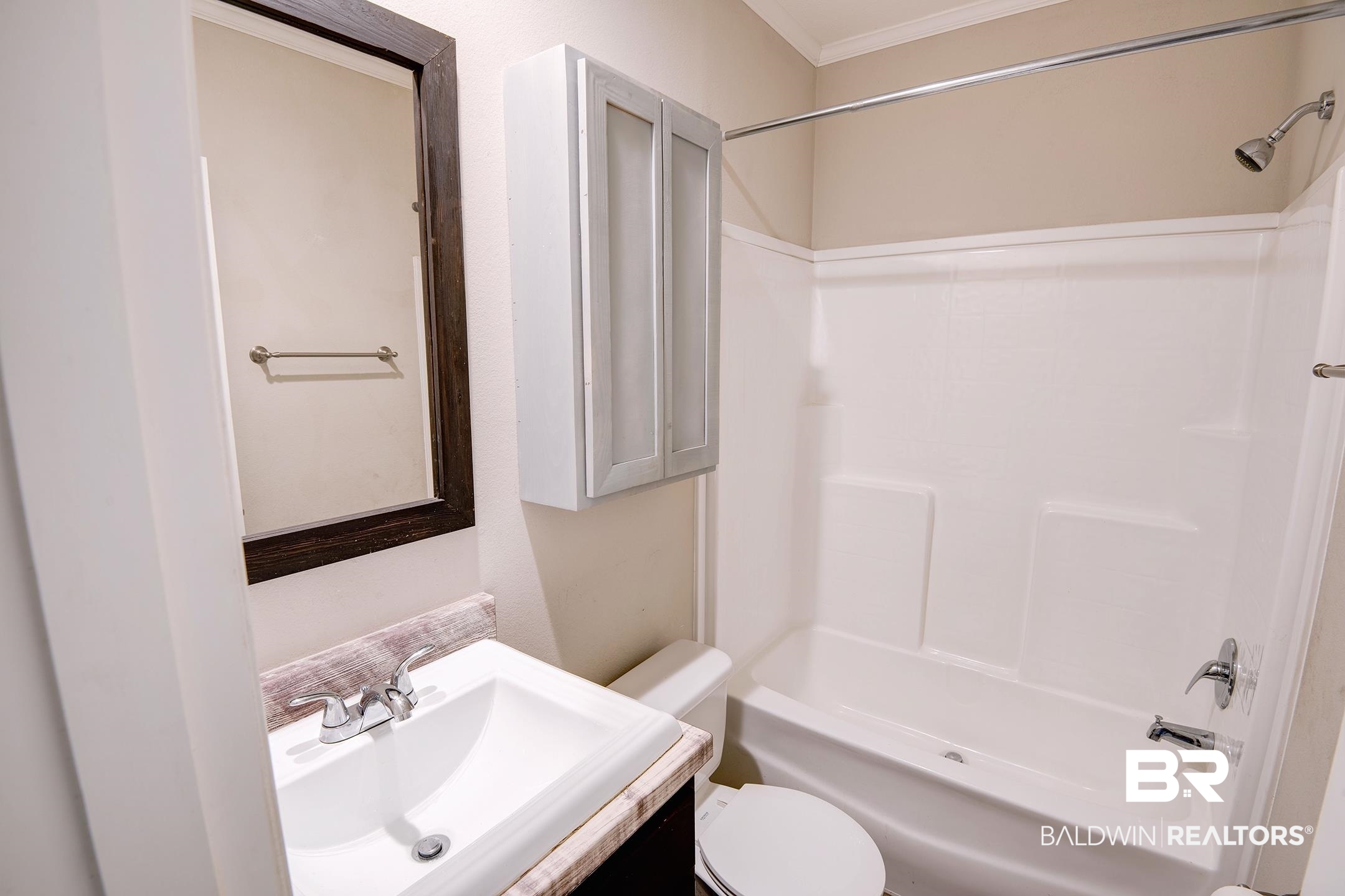 21859 West Side Loop Silverhill, AL 36576 - Photo 9 of 24 Full bathroom with sink, toilet, crown molding, and shower / bathtub combination