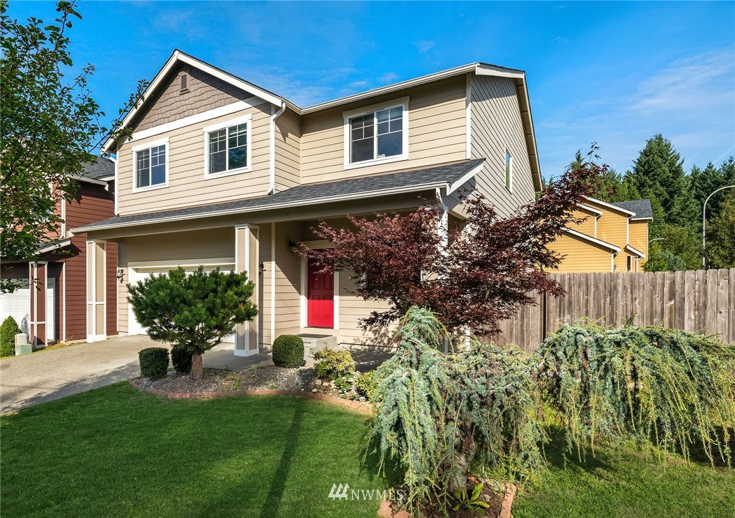 4532 Northeast 10th Street Renton, WA 98059 - Photo 1 of 24 a front view of a house with a yard and potted plants
