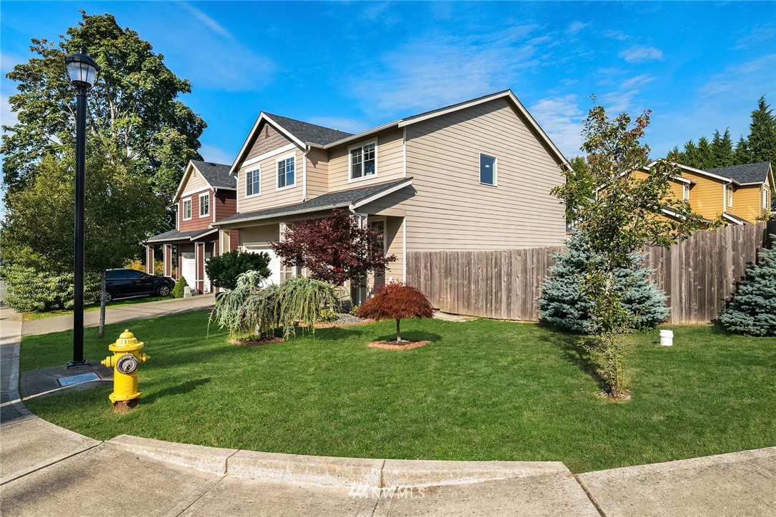 4532 Northeast 10th Street Renton, WA 98059 - Photo 2 of 24 a front view of a house with garden