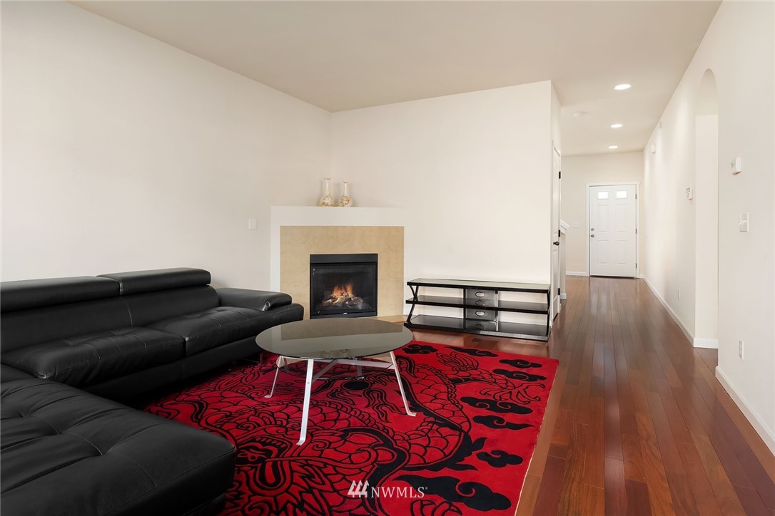 4532 Northeast 10th Street Renton, WA 98059 - Photo 11 of 24 a living room with furniture and a fireplace