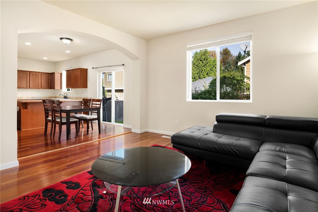 4532 Northeast 10th Street Renton, WA 98059 - Photo 12 of 24 a living room with furniture and a wooden floor