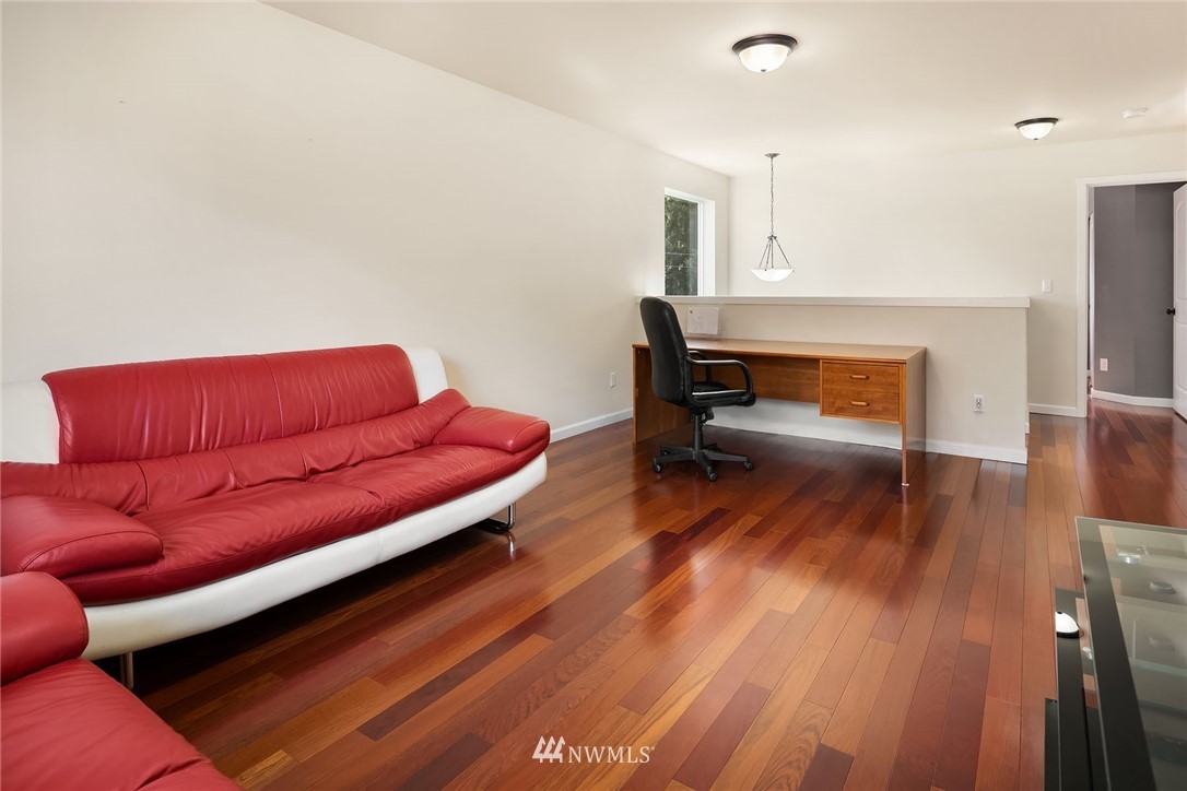 4532 Northeast 10th Street Renton, WA 98059 - Photo 14 of 24 a living room with furniture and a wooden floor
