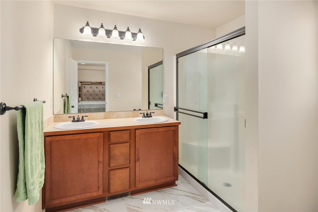 4532 Northeast 10th Street Renton, WA 98059 - Photo 18 of 24 a bathroom with a double vanity sink and a mirror