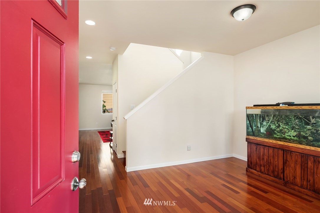 4532 Northeast 10th Street Renton, WA 98059 - Photo 3 of 24 wooden floor in a hall with a window