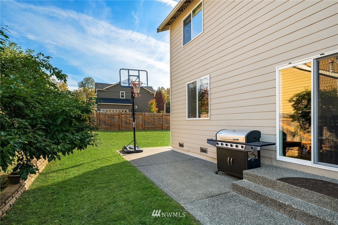 4532 Northeast 10th Street Renton, WA 98059 - Photo 23 of 24 a view of a back yard with patio
