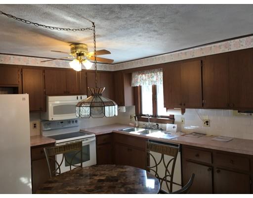 29 Whittier Road Billerica, MA 01821 - Photo 2 of 7 a kitchen with kitchen island granite countertop a sink appliances and cabinets