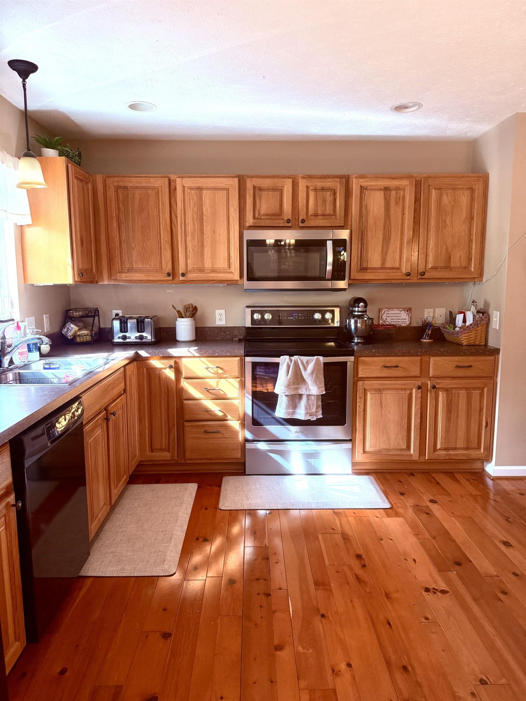 10909 Cook Town Road Bridgewater, VA 22812 - Photo 7 of 23 a kitchen with stainless steel appliances granite countertop a stove a sink and a microwave