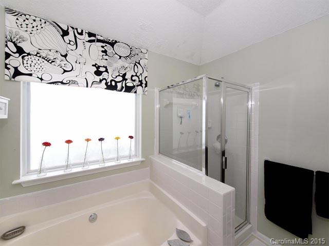 919 Knightsbridge Road Fort Mill, SC 29708 - Photo 13 of 24 a bathroom with a bathtub and a shower