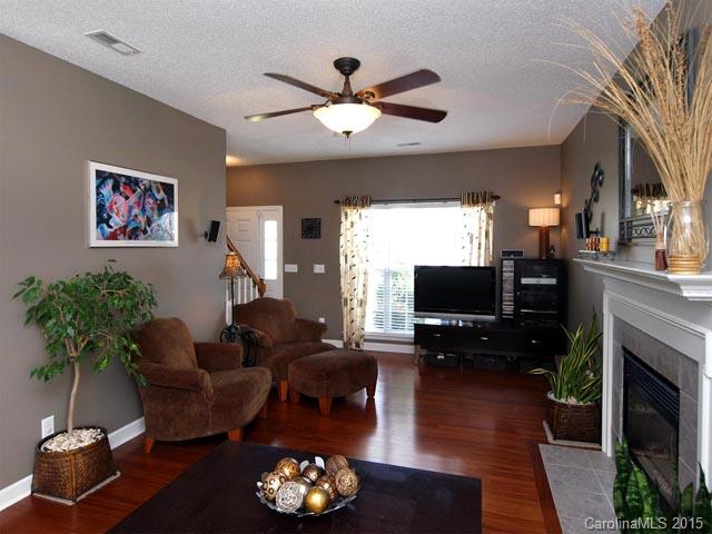 919 Knightsbridge Road Fort Mill, SC 29708 - Photo 4 of 24 a living room with furniture a fireplace and a flat screen tv