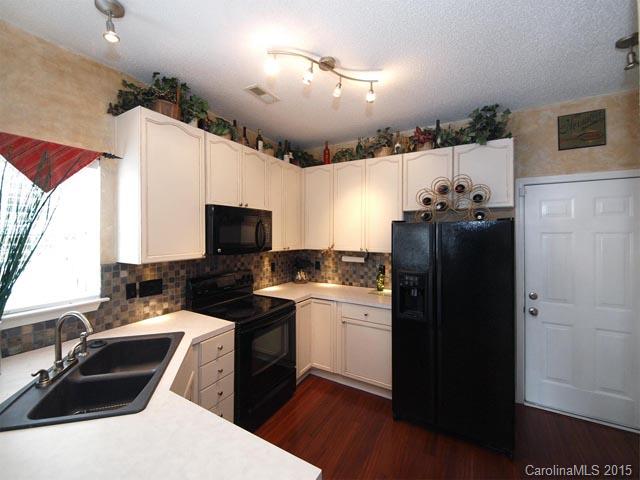 919 Knightsbridge Road Fort Mill, SC 29708 - Photo 6 of 24 a kitchen with a sink stove and refrigerator