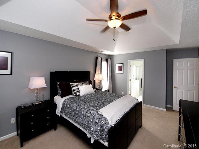 919 Knightsbridge Road Fort Mill, SC 29708 - Photo 10 of 24 a bedroom with a bed and a lamp on dresser