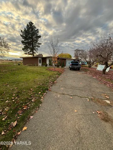 a view of street with parked cars