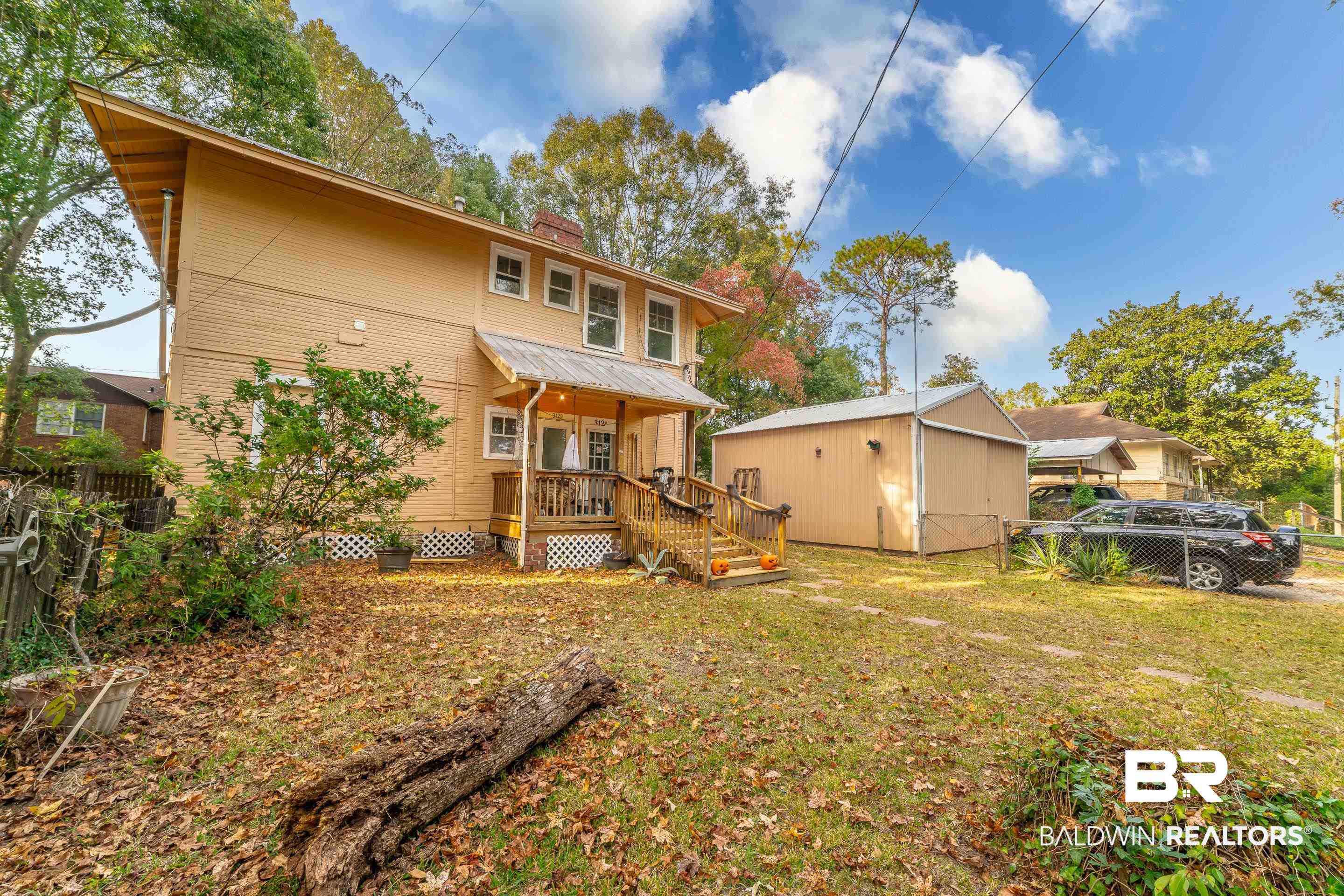 312 1st Street Mobile, AL 36611 - Photo 2 of 29 Rear view of property with an outdoor structure and a lawn