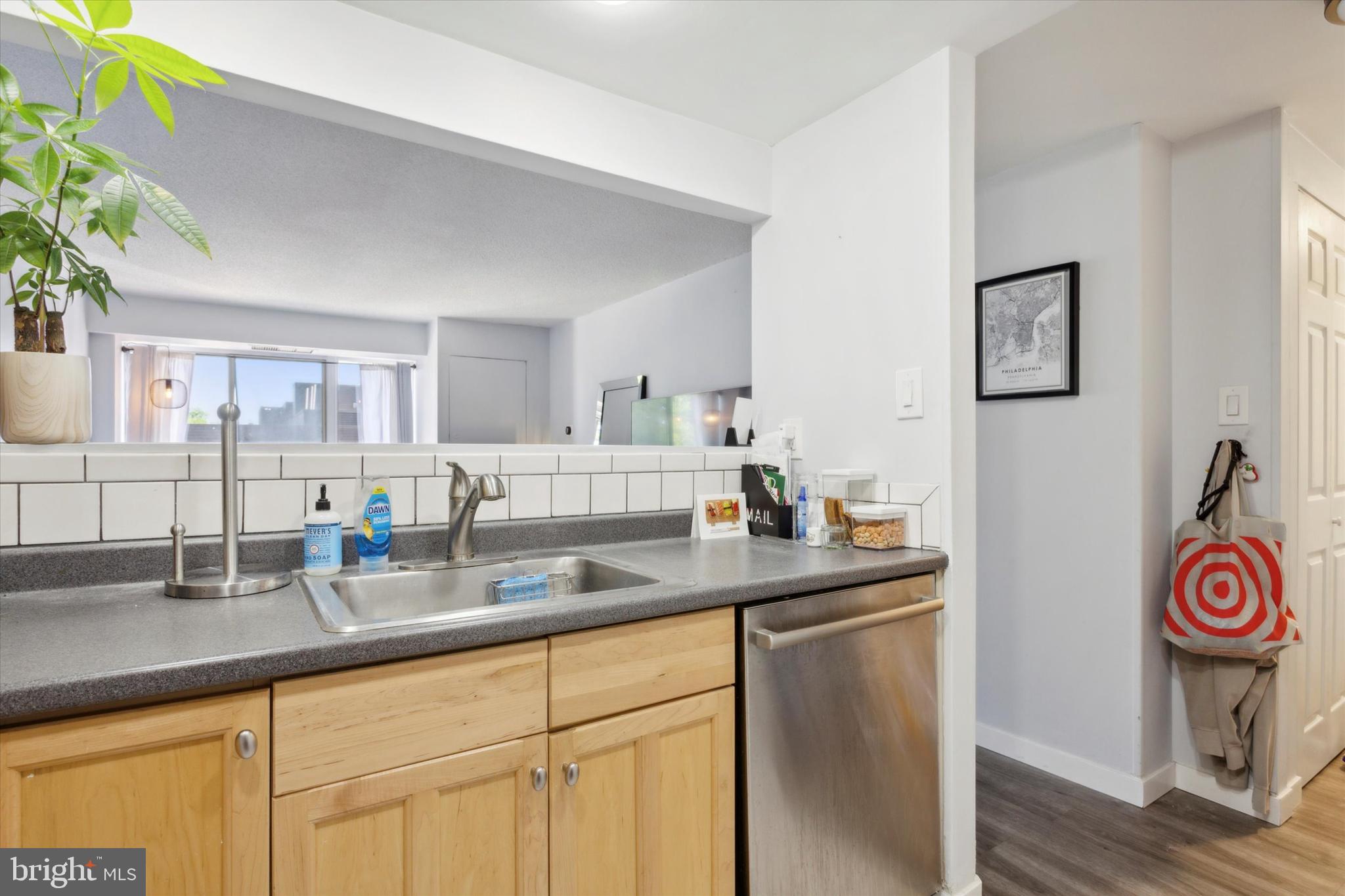 2001 Hamilton Street, Unit 521 Philadelphia, PA 19130 - Photo 11 of 27 a kitchen with stainless steel appliances granite countertop a sink and a cabinets