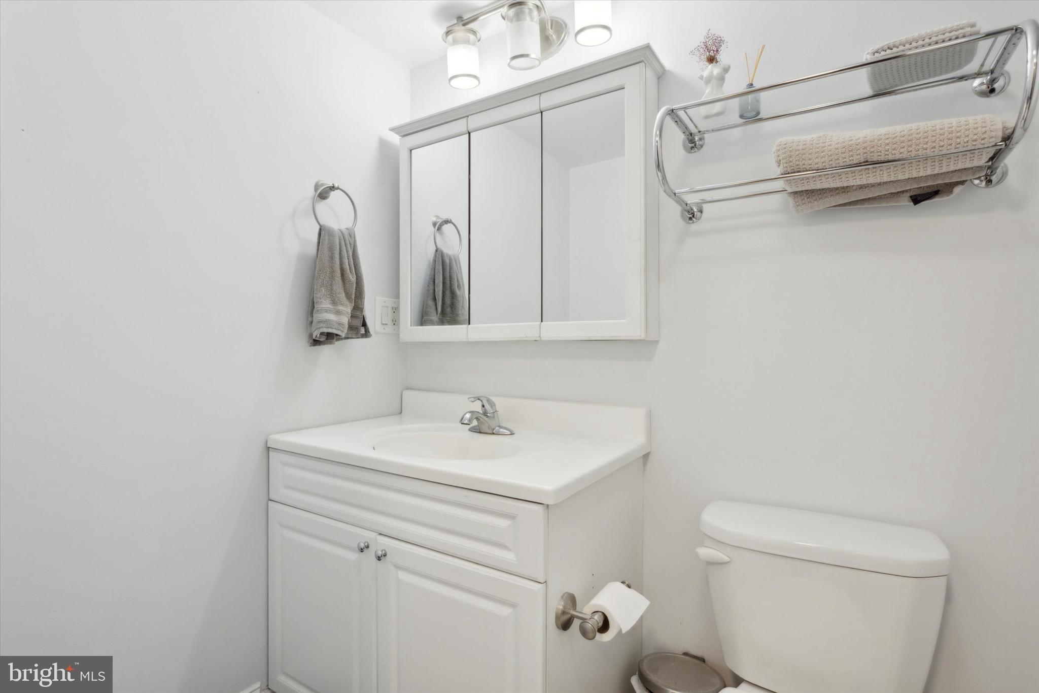 2001 Hamilton Street, Unit 521 Philadelphia, PA 19130 - Photo 13 of 27 a bathroom with a sink a toilet and shower