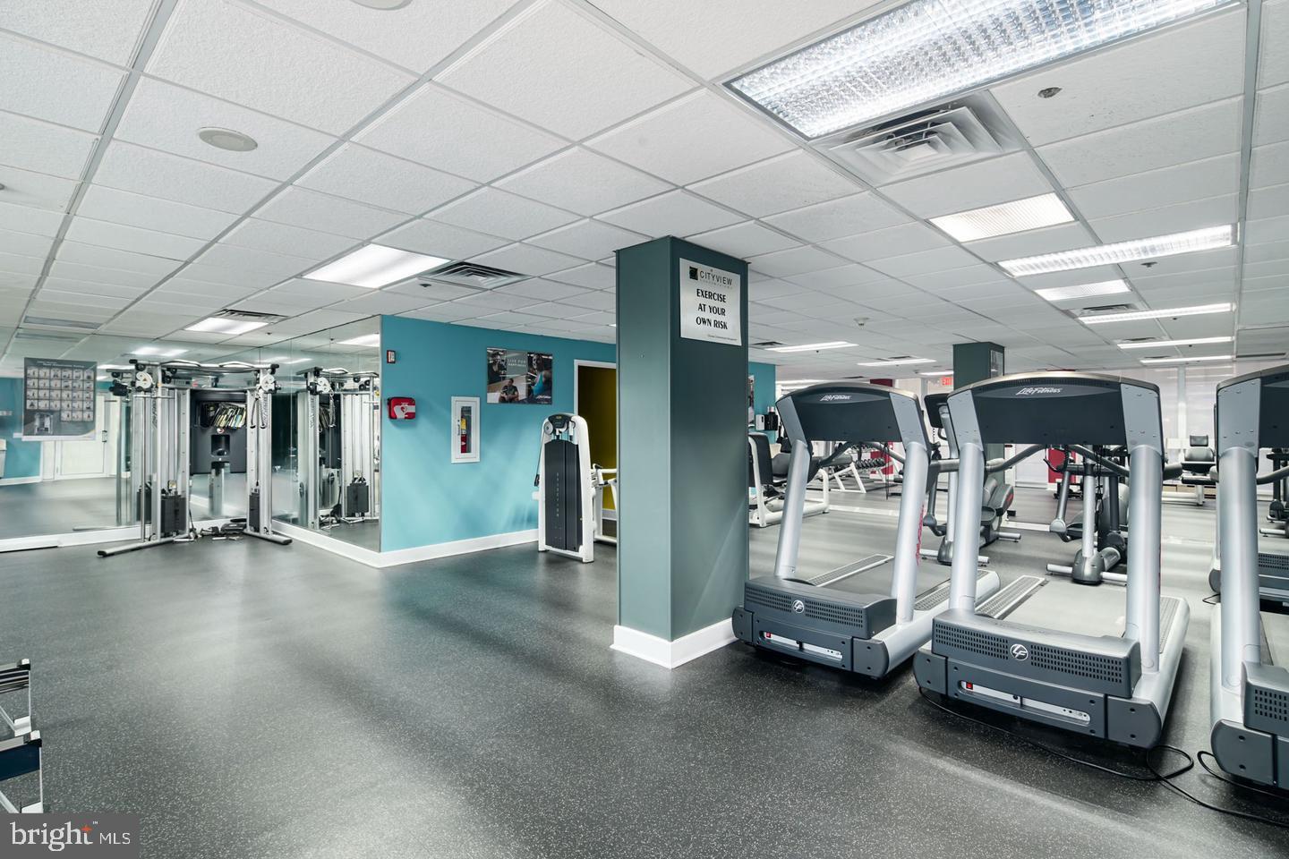 2001 Hamilton Street, Unit 521 Philadelphia, PA 19130 - Photo 23 of 27 a view of parking room with gym equipment