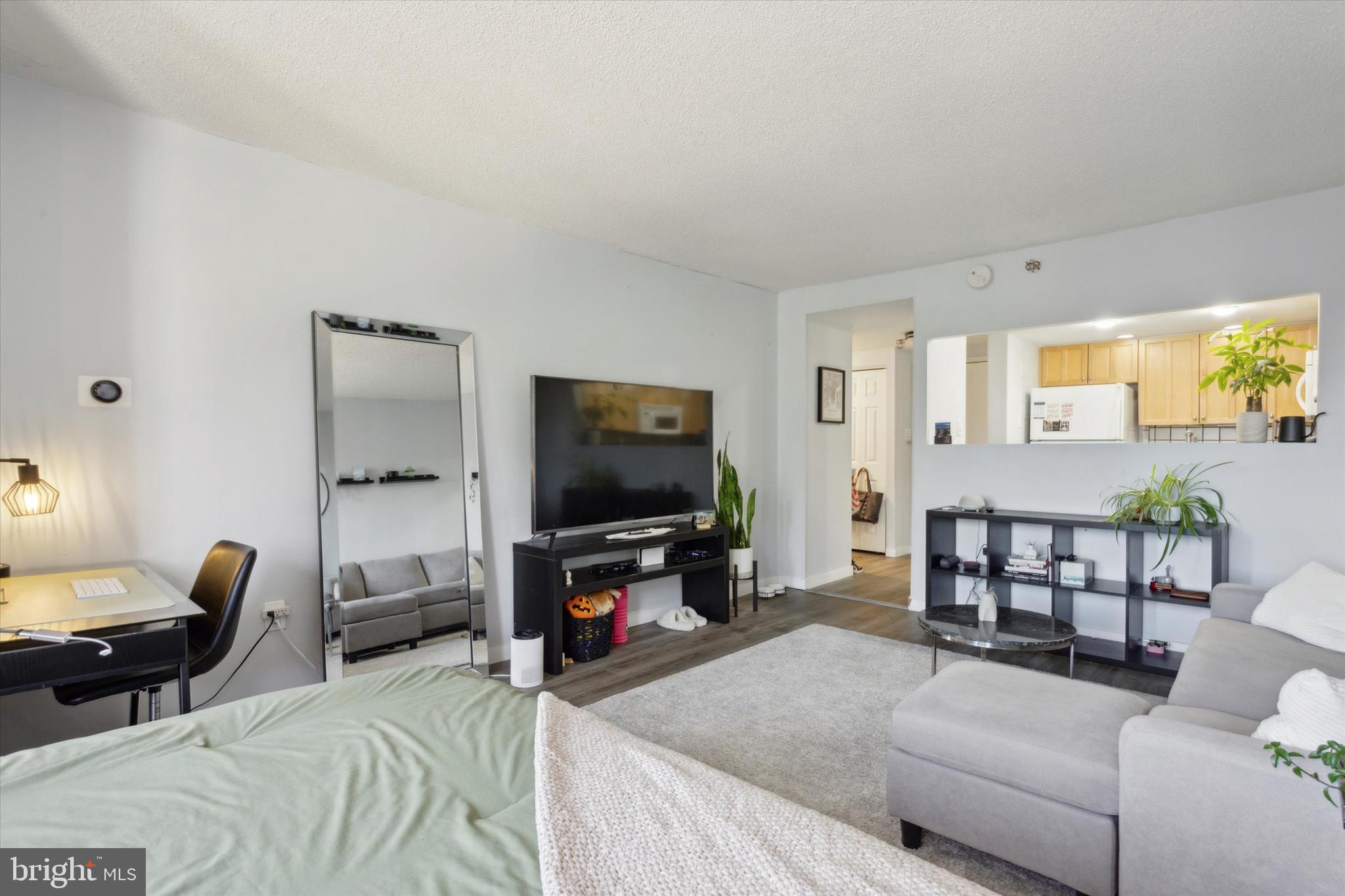 2001 Hamilton Street, Unit 521 Philadelphia, PA 19130 - Photo 9 of 27 a living room with furniture and a flat screen tv
