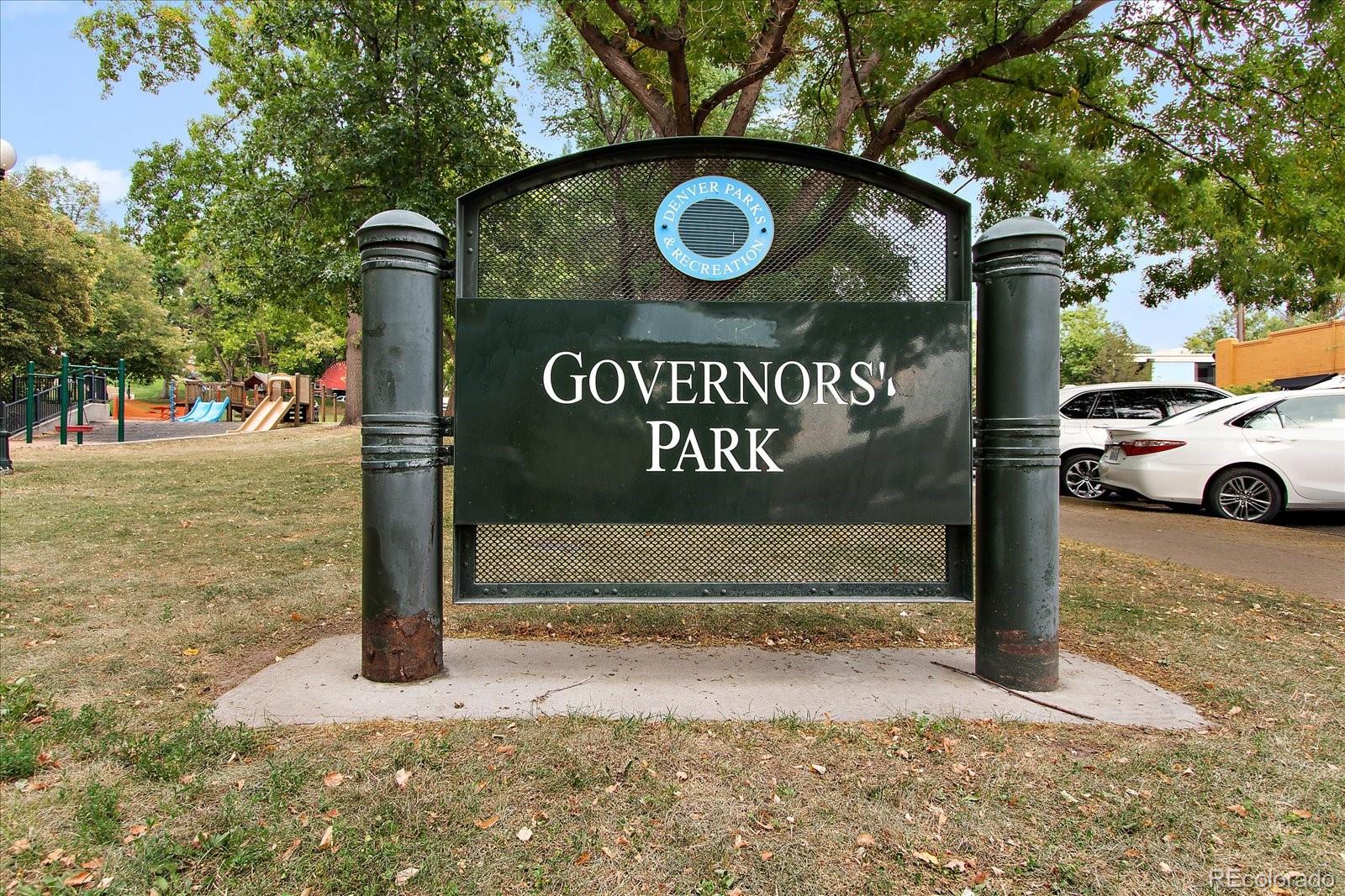 888 Logan Street, Unit 4F Denver, CO 80203 - Photo 21 of 21 a sign on a sidewalk next to a road