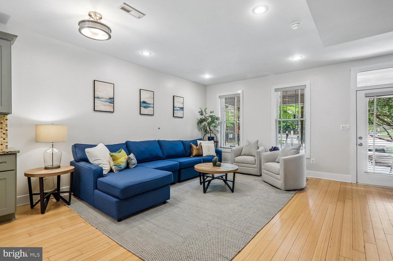 911 L Street Northeast Washington, DC 20002 - Photo 6 of 48 a living room with furniture and a wooden floor