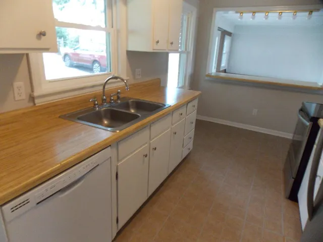 a kitchen with sink and window
