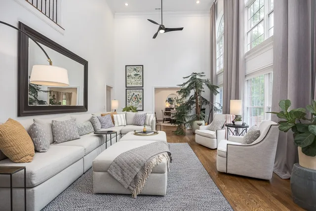 a kitchen with stainless steel appliances granite countertop a stove top oven a sink a refrigerator and white cabinets