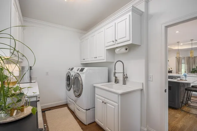 a kitchen with stainless steel appliances kitchen island granite countertop a sink and cabinets