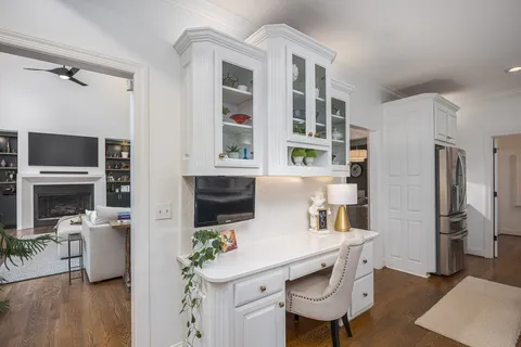 a white bath tub sitting next to a small bathroom