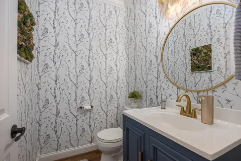 a en suite bathroom with a double vanity sink and a mirror