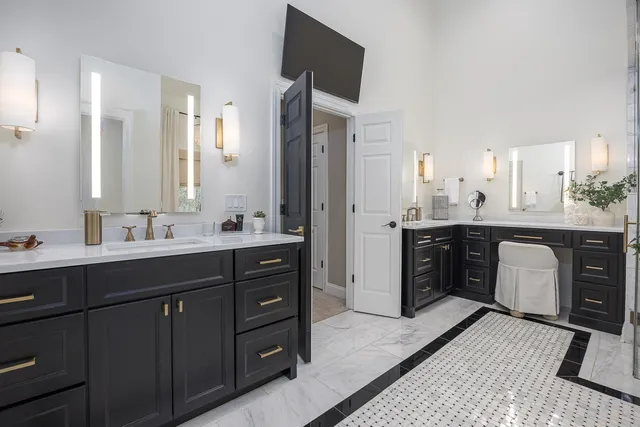 a bedroom with a bed and painting on the wall