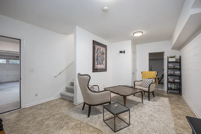 an aerial view of a house with a yard table and chairs