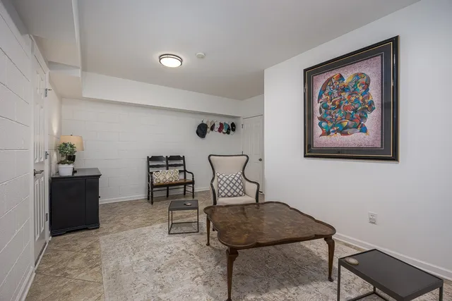 an aerial view of a house with a yard basket ball court and outdoor seating