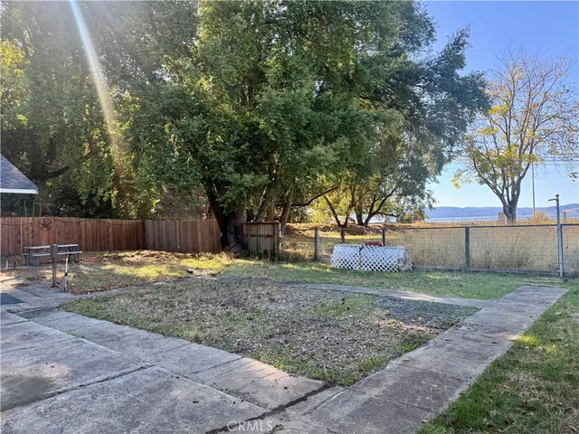 a backyard of a house with a trees