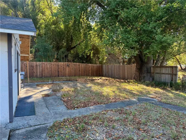 a view of outdoor space with wooden fence