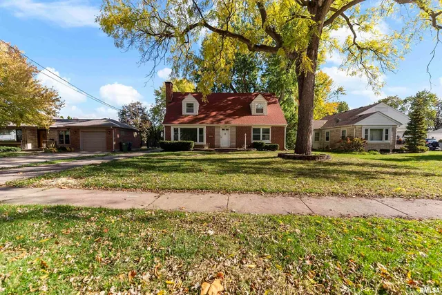 a house with garden in front of it